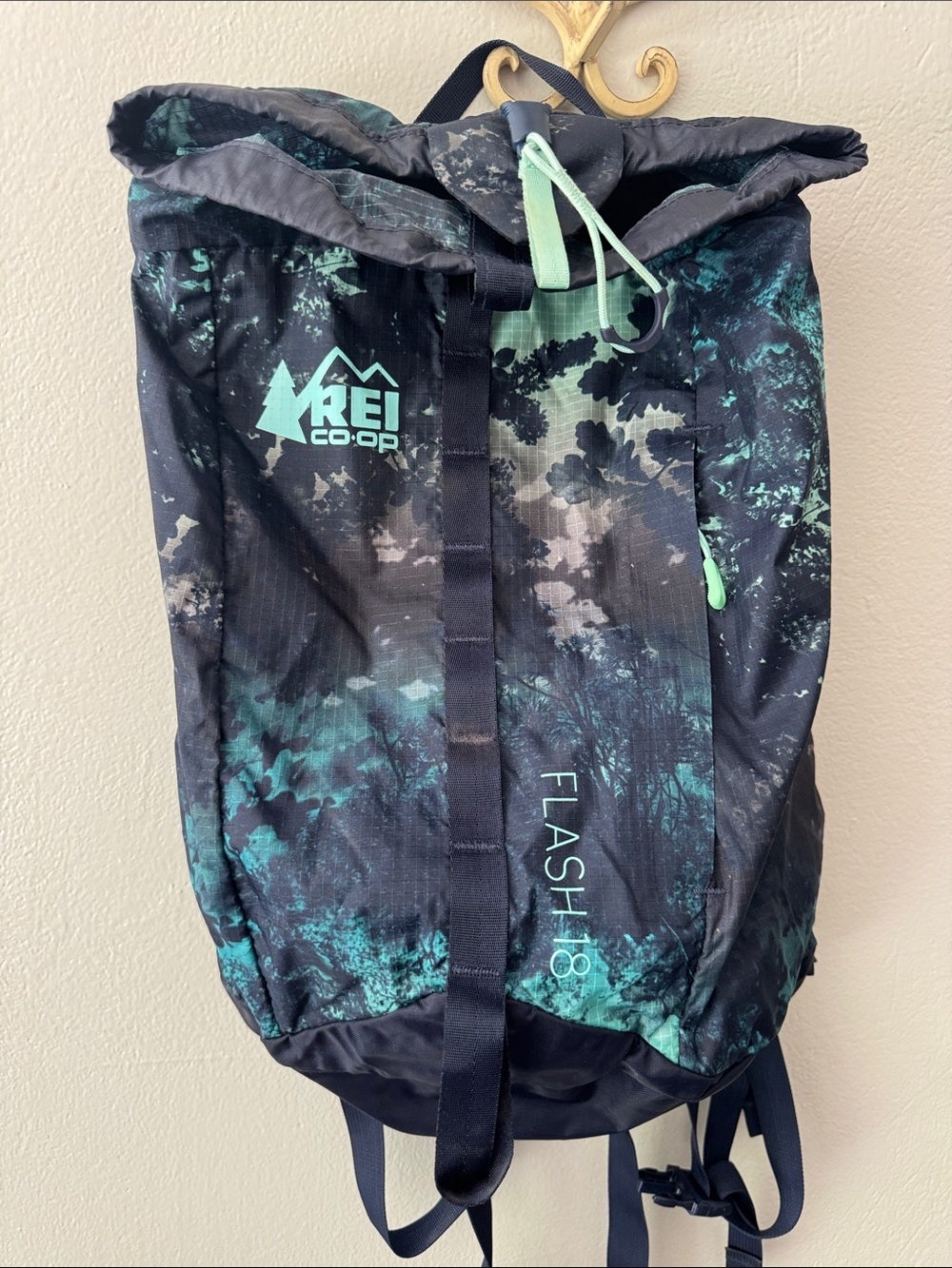 REI teal and black hiking daypack